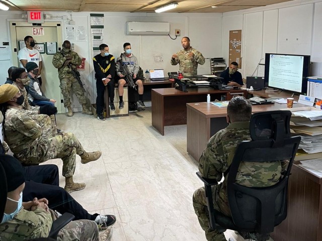Sgt. 1st Class Hayes Clark, an inspector general noncommissioned officer for the 1st Theater Sustainment Command operational command post, briefs Soldiers in Erbil, Iraq, in February of 2022 during battlefield circulation.
