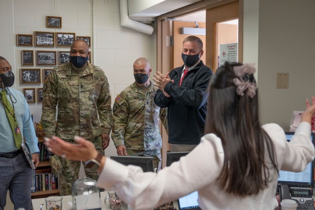 Craig Deatrick, Director of Installation Management Command-Pacific, applauds the enthusiasm of an American Red Cross employee during a tour of Camp Walker, Republic of Korea, March 29, 2022. Deatrick visited U.S. Army Garrison Daegu to tour installation facilities and recognize members of the IMCOM team for outstanding service.