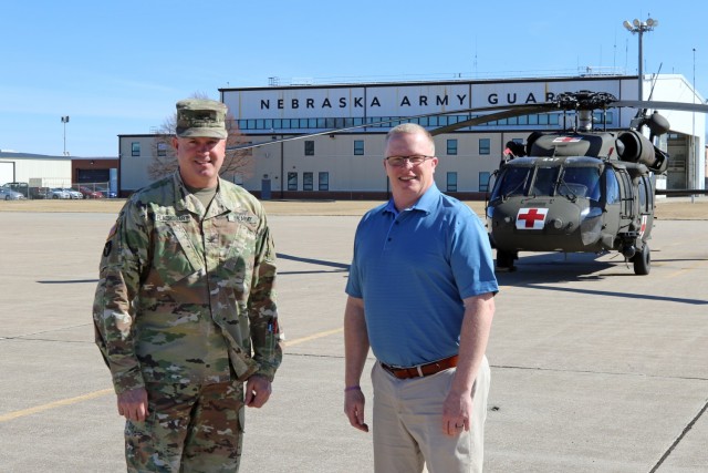 Col. Brent Flachsbart, Nebraska Army National Guard construction and facilities maintenance officer, and Lawrence Vrtiska, environmental program manager for the Nebraska Military Department, outside Army Aviation Support Facility #1 in Lincoln, Neb., March 1, 2022. The Nebraska Army National Guard was awarded 1st place for Natural Resources Management (Individual/Team) in the 2022 Secretary of the Army Environmental Awards for its work with the U.S. Geological Survey and the Crane Trust to study endangered whooping crane behavior during their annual migration through central Nebraska. (Photo by Maj. Scott Ingalsbe)

