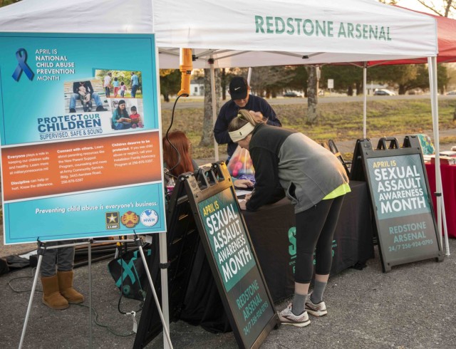 Redstone Arsenal personnel and Family members participated in an early morning 5K run and one mile walk in honor of Sexual Assault and Awareness and Child Abuse Prevention Month April 1, 2022, on the installation.