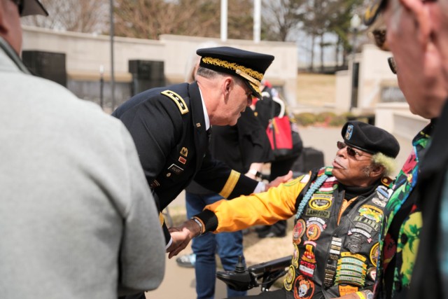 Lt. Gen. Donnie Walker expresses his appreciation to Vietnam veteran and retired Sgt. Maj. Bobby Langford during the 10th annual Vietnam Veterans Day Celebration at the Huntsville-Madison County Veterans Memorial March 29, hosted by the Vietnam Veterans of American Chapter 1067. Langford, the first vice president of Vietnam Veterans of America Chapter 1067, called the roll call at the celebration that recognized the VVA chapter members who died during the past two years. 
