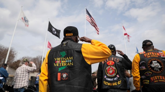 Vietnam veterans salute during the 10th annual Vietnam Veterans Day Celebration at the Huntsville-Madison County Veterans Memorial March 29. The event was hosted by the Vietnam Veterans of America, Chapter 1067.