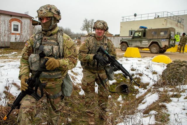 Spc. Austin Pogreba and Sgt. Kevin Delwiche man a cold check point during Allied Spirit 22 in the Joint Multinational Readiness Center training area near Hohenfels, Germany. Civil Affairs Soldiers from the U.S. Army Reserve’s 432nd Civil Affairs Battalion, 353rd Civil Affairs Command, supported the multinational exercise from Jan. 21 through Feb. 5, 2022. A Green Bay, Wisconsin-based U.S. Army Reserve unit, the 432nd Civil Affairs Battalion took part in the winter exercise alongside with allied militaries. Led by the German Army&#39;s 1st Armoured Division the exercise, directed by U.S. Army Europe and Africa and conducted by the 7th Army Training Command, enabled integration between allies and partners in a competitive combat training environment.