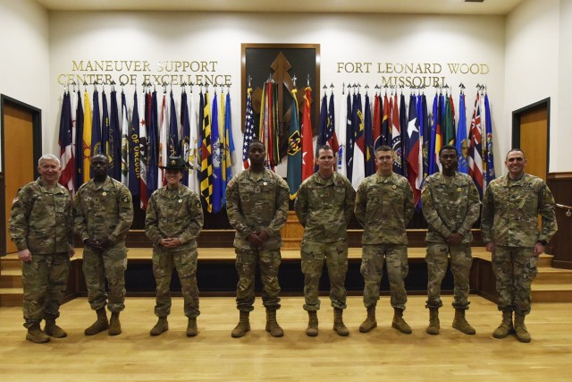 Maj. Gen. James Bonner, Maneuver Support Center of Excellence and Fort Leonard Wood commanding general (left), and MSCoE and Fort Leonard Wood Command Sgt. Maj. Randolph Delapena (right) announced the winners of the 2022 Best Warrior Competition during a ceremony today at Lincoln Hall Auditorium. The winners, from left, are 1st Lt. Daniel Nyachwaya, Company C, 3rd Battalion, 10th Infantry Regiment, Officer of the Year; Staff Sgt. Krista Osborne, Company B, 2nd Battalion, 10th Infantry Regiment, Drill Sergeant of the Year; Staff Sgt. Shomone Hemphill, Company D, 31st Engineer Battalion, NCO of the Year; Air Force Tech. Sgt. Chance Sheek, 368th Training Squadron, Joint Service NCO of the Year; Spc. Eric Dowler, 399th Army Band, Soldier of the Year; and Cpl. Marcus Destine, CESD, 35th Engineer Battalion, Joint Service Junior Enlisted of the Year.