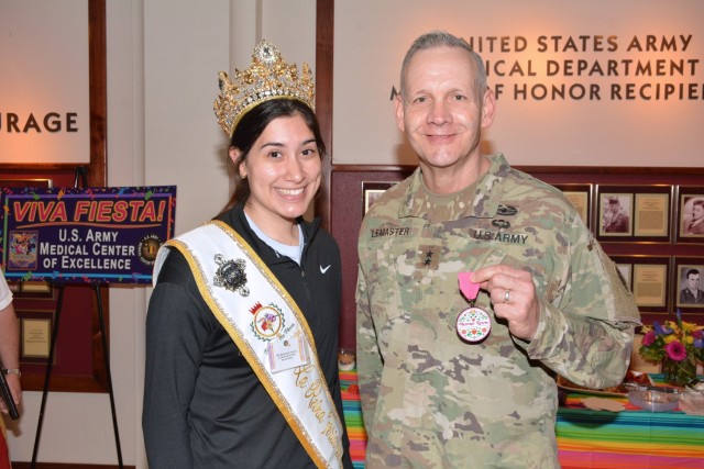 The U.S. Army Medical Center of Excellence (MEDCoE), hosted a leader breakfast in honor of the 2022 Fiesta Court and Fiesta Commission at Fort Sam Houston, Joint Base San Antonio, March 30, 2022. The event was intended to be proceeded by the Annual MEDCoE “Viva Fiesta” Run that was cancelled due to projections of lightning and thunderstorms. Pictured, Mackenzie Tijerina, La Reina de la Feia de Las Flores and Maj. Dennis LeMaster, MEDCoE Commanding General. 