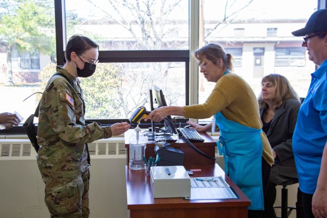 Warrior Restaurant personnel scanning a Soldiers ID for lunch. 