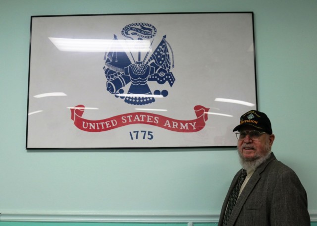 Maryland Veterans Commissioner Stanley Seidel, a Vietnam veteran poses by an U.S. Army sign. 
 