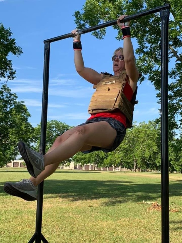 A participant in the 2019 Memorial Day MURPH completes a pull-up. Fort Jack-
son participants were also tasked with completing two one-mile runs, 200
push-ups and 100 pull-ups and 300 air squats to complete the challenge.