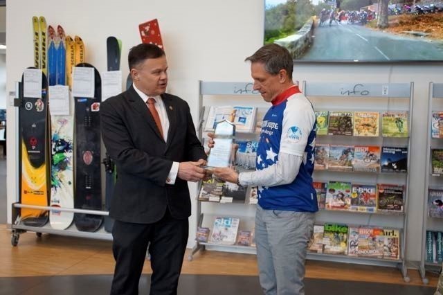 Tommy Mize, director of Installation Management Command Directorate-Europe, recognizes Fred Proctor April 7 at the Wiesbaden Outdoor Recreation Center. Proctor, a security specialist at the 2nd Theater Signal Brigade in Wiesbaden, was the top male finisher of the 2021 IMCOM-Europe Cycling Challenge with the most kilometers achieved in the competition.  