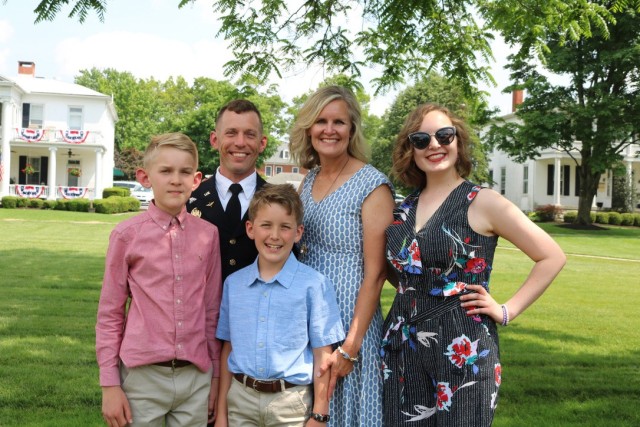 Top right, Elena Ashburn, the 2022 Operation Homefront Army Military Child of the Year poses with her family for a photo.