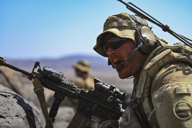 U.S. Army Staff Sgt. Chris Barksdale, a squad leader with the East Africa Response Force (EARF), Task Force Red Dragon, Combined Joint Task Force – Horn of Africa, commands his team during Exercise WAKRI 22 at Grand Bara, Djibouti, March 15, 2022. Exercise WAKRI 22, the largest annual French-led exercise on the African continent, was spread out across Djibouti and provided realistic training for French Armed Forces&#39; air, ground and sea components alongside their U.S. allies. (U.S. Air Force photo by Senior Airman Blake Wiles)