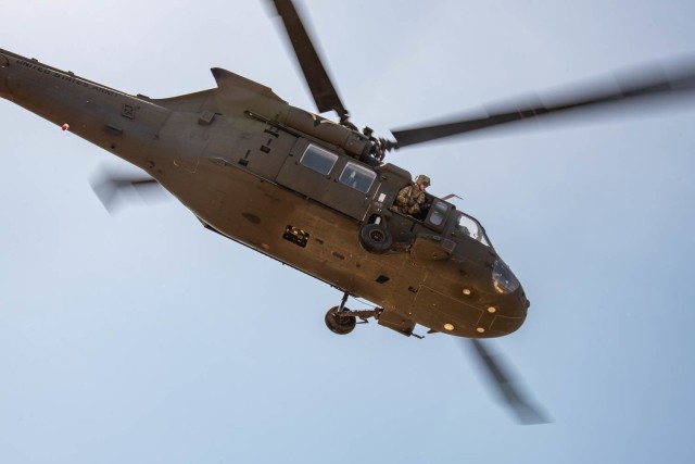 A UH-60 Black Hawk takes off after participating in a point of injury demonstration during a medical knowledge exchange in Oklahoma City, April 1, 2022. The knowledge exchange involved the participation and support of Guardsmen with both the Oklahoma Army and Air National Guard in support of the State Partnership Program. 