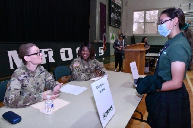 Col. Shannon Shaw, seated left, Director of the Leader Training Division and Maj. Lakeisha Logan, seated right, Deputy Command Surgeon entertain student questions after a panel for junior and seniors during the Incarnate Word High School 2022 Science, Technology, Religion, Engineering, Arts & Math (STREAM) Speaker Series, April 5, 2022, San Antonio, Texas.