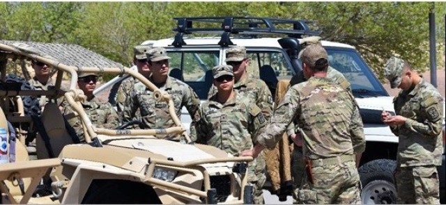 Sgt. 1st Class Shaun Bratton describes vehicle capabilities and specifications with NMSU Cadets.
