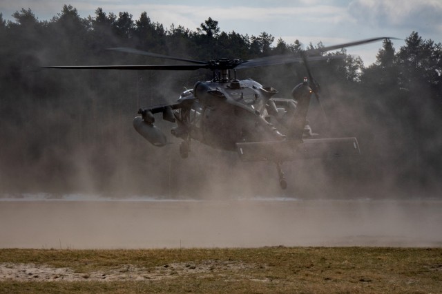 A UH-60 Blackhawk helicopter from the 1-214th General Support Aviation Battalion, 12th Combat Aviation Brigade lands in simulated hostile territory during a personnel recovery exercise at the Nowa Deba Training Area, Poland, April 4, 2022. This exercise and others like it enhances our interoperability with our NATO allies and partners strengthens the regional relationships that we have developed. 12 CAB is the only enduring aviation brigade present throughout Europe that enables us to deter and defend against threats from any direction. (U.S. Army photo by Staff Sgt. Thomas Mort)