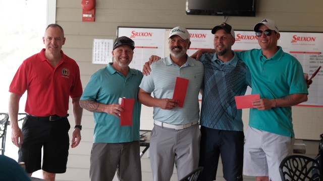 Brig. Gen. John D. Kline, commanding general, U.S. Army Center for Initial Military Training, Training and Doctrine Command presented the second place prize during the Fourth Annual SHARP Golf Tournament at Fort Eustis, Va. April 14