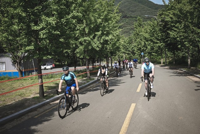 Participants of the 2021 Cycling Challenge take part in a group ride in Gachang Valley, South Korea.