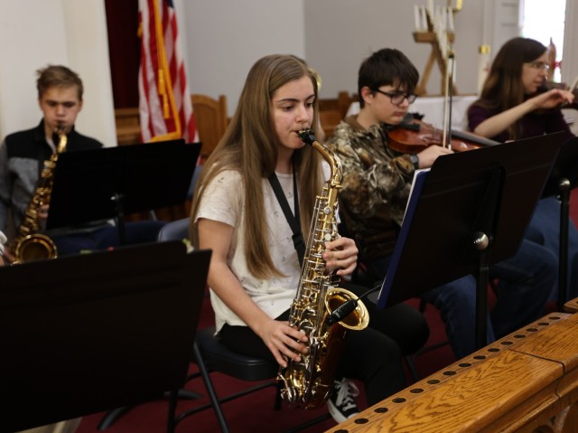 Ninth grade Fort Knox Middle High School student Hope Moss plays her saxophone April 15, 2022 at the final practice before Easter Sunday service where the Main Post Chapel orchestra performed. 