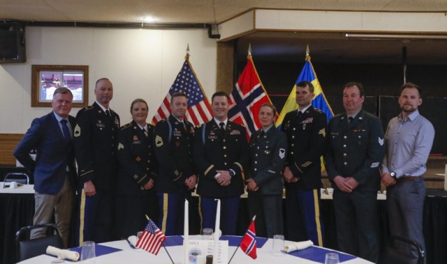 Participants of the 49th annual Norwegian Exchange, from the Norwegian Heimevernet, or Home Guard, and the Minnesota National Guard, community leaders, buddy weekend host families and distinguished guests joined together for a farewell banquet, April 3, 2022 at the Falls Ballroom in Little Falls, Minnesota. (Minnesota National Guard photo by Sgt. Mahsima Alkamooneh)