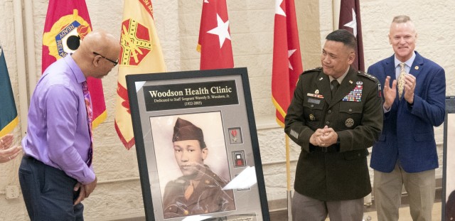 The Woodson Health Clinic is dedicated on Rock Island Arsenal, Ill., on April 14, named in honor of First Army D-Day hero, Staff Sgt. Waverly Woodson. From left are: Woodson&#39;s son, Stephen Woodson; First Army Commanding General, Lt. Gen. Antonio Aguto Jr.; and former First Army Commanding General, retired Lt. Gen. Thomas James Jr. 