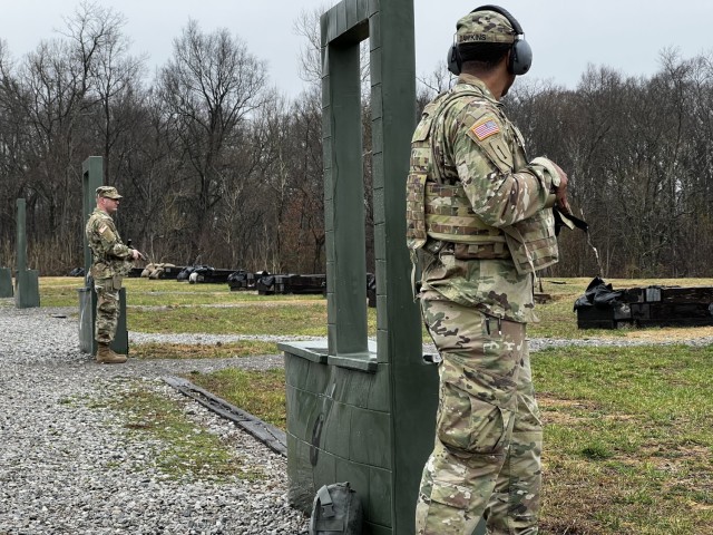 Soldiers of the 135th ESC prepare to execute the M-17 qualification course