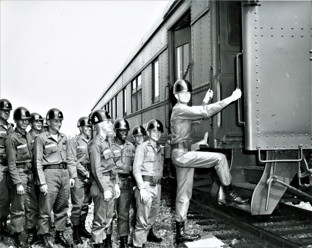 Transportation officers training on a train