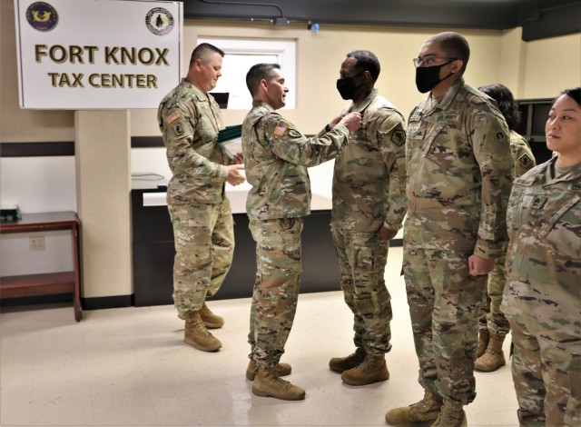 Fort Knox Tax Center Soldiers are honored by Fort Knox Garrison Commander Col. Lance O’Bryan and Garrison Command Sgt. Maj. William Fogle April 20, 2022 for their efforts throughout the 2022 tax season.
