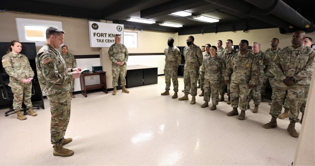 Fort Knox Garrison Commander Col. Lance O’Bryan reads the dollar totals that the tax center team achieved in returns over the 2022 season, saving the community 35% more in filing fees than the previous year.