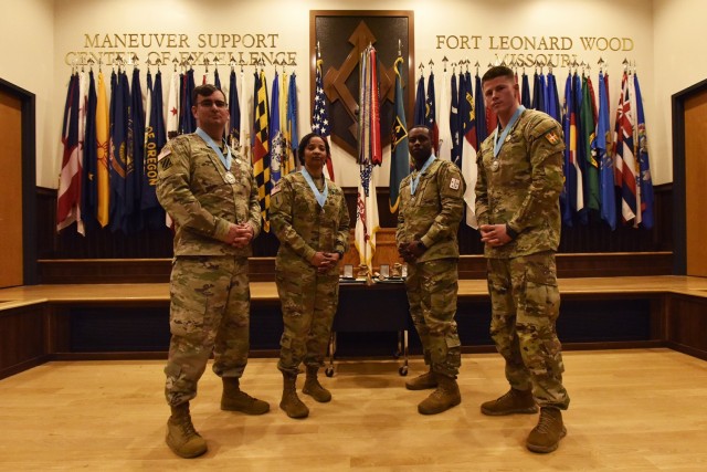 The Ozark Chapter of the Sergeant Audie Murphy Club inducted four new members April 19 during a ceremony in Lincoln Hall Auditorium. The inductees included, from left, Sgts. 1st Class Michael Kotz, from the MSCoE NCO Academy, and Markia Crumpler, from Headquarters and Headquarters Company, Maneuver Support Center of Excellence; and Staff Sgts. Antonio Gattison, from the 58th Transportation Battalion, and Nicholas Potter, from the 795th Military Police Battalion. 