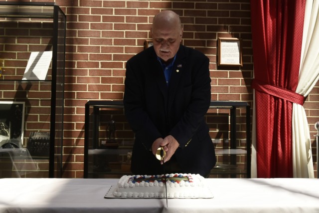 Roger Layman, Army Reserve Ambassador to Missouri, cuts the birthday cake celebrating 114 years of the Army Reserve during a ceremony April 19 in the Engineer foyer of the Maneuver Support Center of Excellence building. After Layman spoke at the event, Brig. Gen. Susie Kuilan, commanding general for the 95th Training Division, Fort Sill, Oklahoma, noted that Army Reserve drill sergeants fill critical positions at Fort Leonard Wood.
