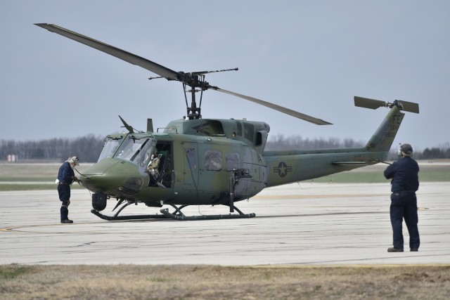 The crew of an Air Force UH-1N “Huey” helicopter gets ready to take off April 12 from Forney Airfield to conduct a training mission at Fort Leonard Wood’s Cannon Range. Two Hueys from the 37th Helicopter Squadron at F.E. Warren Air Force Base, Wyoming, were here last week to meet training currency requirements for aerial gunnery and close air support. Their mission at F.E. Warren is to provide security and transportation at America’s expansive nuclear missile ranges. (Photo by Brian Hill, Fort Leonard Wood Public Affairs Office)