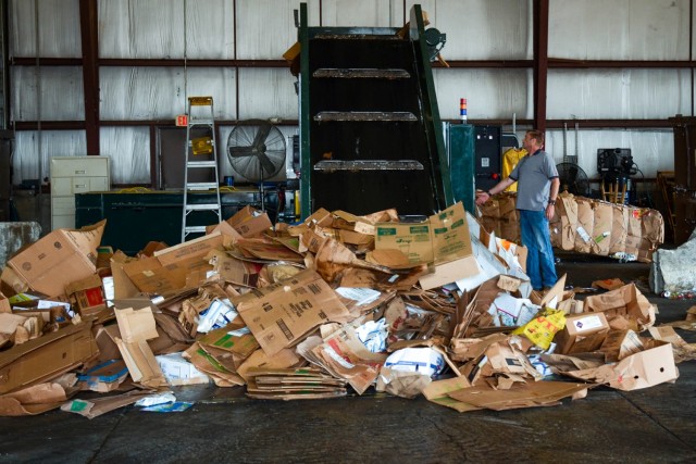 Robert Schultz, an environmental protection assistant with the Directorate of Public Works’ Environmental Division, demonstrates how a baler is used to condense dropped-off recyclables for transport April 21 at the Fort Leonard Wood Recycling Center. 