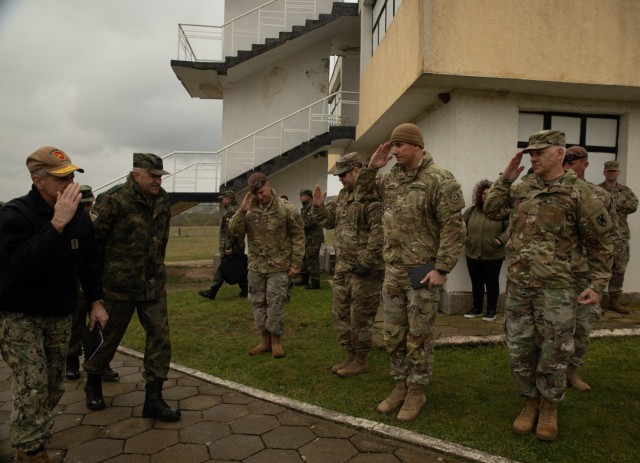 U.S. Navy Adm. Robert Burke, commander of Allied Joint Force Command Naples, returns a salute to leaders of rotational units deployed to Novo Selo Training Area, Bulgaria, during a demonstration of capabilities, on April 19, 2022. These rotational...