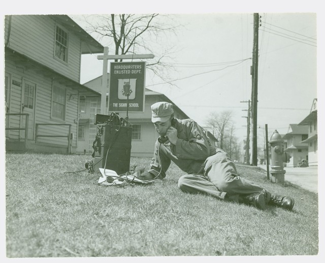 A student at Fort Monmouth, New Jersey, demostrates the use of a Korean War-era walkie-talkie, 1951. 