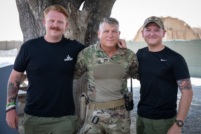 Staff Sgt. Daniel Fisher stands with two of his sons, Spc. Caleb and Spc. Jacob Fisher. The three are all deployed with the Virginia Army National Guard’s Task Force Red Dragon, assigned to Combined Joint Task Force-Horn of Africa. (Photo by...