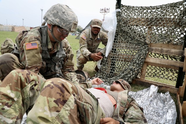 A participant in the U.S. Army Japan Expert Soldier Badge competition performs a task in the medical lane at Sagami General Depot, Japan, April 21, 2022. 