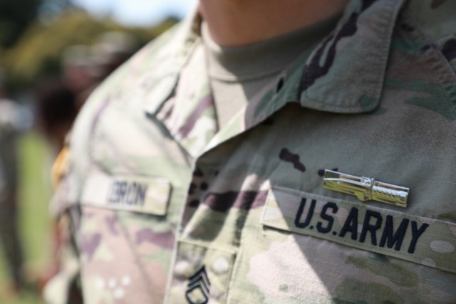 An Expert Soldier Badge is seen on the uniform of Staff Sgt. Holden Lebron, assigned to 38th Air Defense Artillery Brigade, following an award ceremony at Sagami General Depot, Japan, April 22, 2022.  