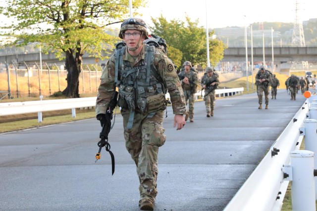 Participants in the U.S. Army Japan Expert Soldier Badge competition conduct a 12-mile ruck march at Sagami General Depot, Japan, April 22, 2022.  Twenty-three Soldiers earned the coveted badge after a grueling weeklong competition, which initially had about 120 participants in USARJ’s first-ever testing event for the newest skill badge in the Army.