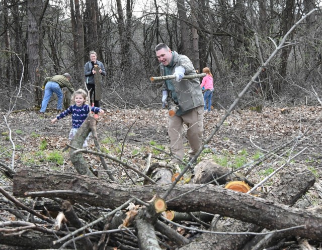 Dozens of 10th Mountain Division (LI) Soldiers and family members joined Friends of Thompson Park volunteers for a trail cleanup effort April 23 at Thompson Park. 