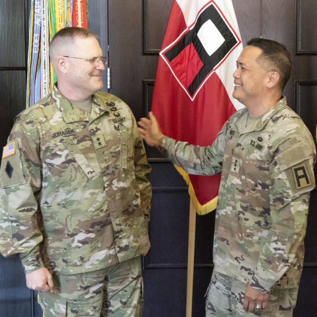 Lt. Gen. Antonio Aguto Jr. (right), First Army commanding general, shares a laugh with Maj. Gen. Jeffrey Jurasek, First Army commanding general for support, during Jurasek&#39;s promotion ceremony.