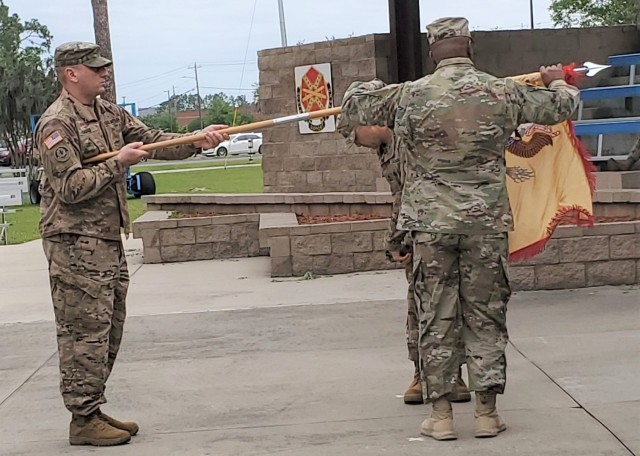 Soldiers from the 904th CBN uncase their colors