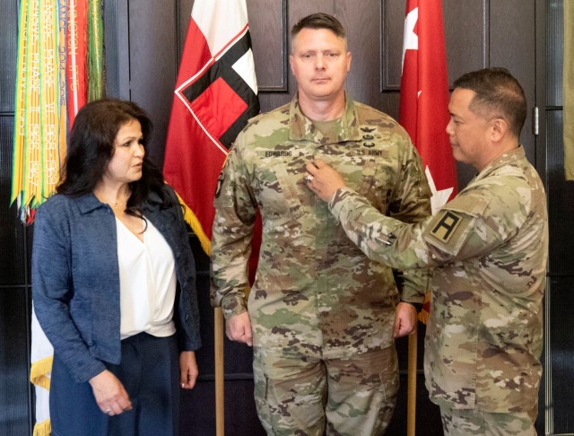Maj. Gen. Joseph Edwards II, First Army Division West commanding general, receives his second star during a promotion ceremony in First Army headquarters, with First Army Commanding General, Lt. Gen. Antonio Aguto Jr., affixing his new rank.