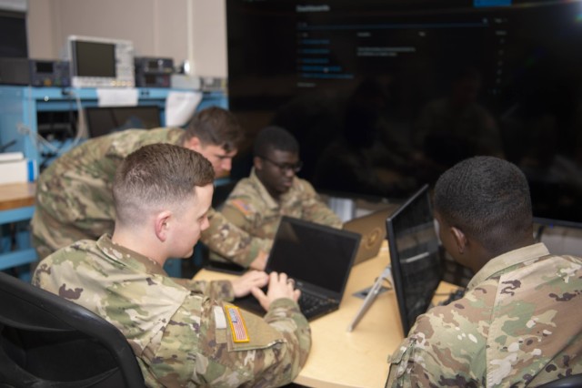 United States Military Academy Cadet Joseph Cilenti demonstrates to other cadets exactly how the Distributed Network Defense Solution enables network intrusion detection and prevention systems, all while keeping the network policed even when a monitor is not physically present. 