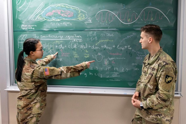 U.S. Military Academy cadets, Dominic A. Rudakevych, right, and Genevieve Tang prepare to demonstrate how space weather impacts GPS signals, the physics behind these impacts, and the technology that it relies on, April 21, 2022 at West Point. 