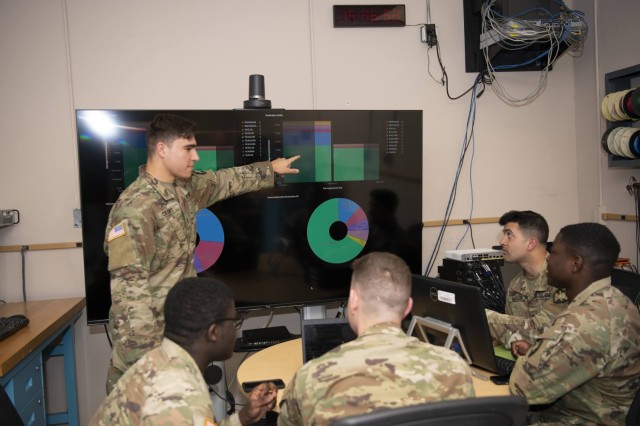United States Military Academy Cadet Joseph Cilenti demonstrates to other cadets exactly how the Distributed Network Defense Solution enables network intrusion detection and prevention systems, all while keeping the network policed even when a monitor is not physically present. 