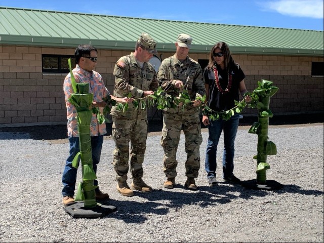 Lance Sewake, chief of PTA’s Directorate of Public Works; Lt. Col. Kevin Cronin, commander of Pohakuloa Training Area; Lt. Col. Eric Marshall, commander of U.S. Army Corps of Engineers, Honolulu District; and Kimberly Nakasato, CEO of Nakasato Contracting LLC, untie the maile lei during a blessing ceremony at Pohakuloa Training Area, April 26. 