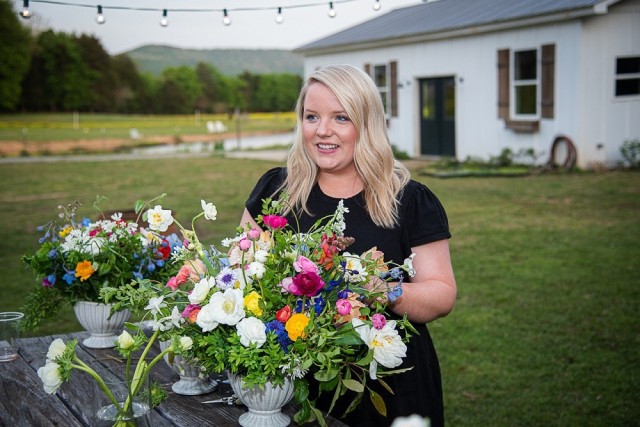 Savanah Hogan enjoys a floral arrangement at Field and Forage Flower Farm.