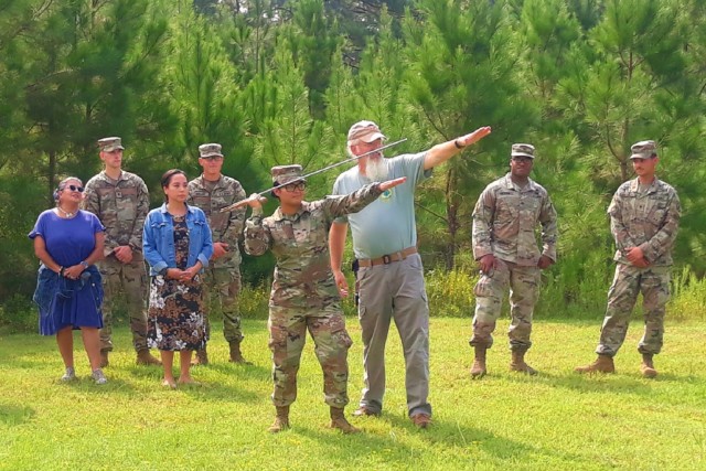 Fort Polk personnel demonstrate atlatl-throwing techniques as part of a comprehensive outreach and training plan. Multiple environmental training courses provide Soldiers and civilians with an overview of installation cultural resources. Students learn the reporting process for inadvertent discoveries of cultural resources as well as how to identify and protect sites.