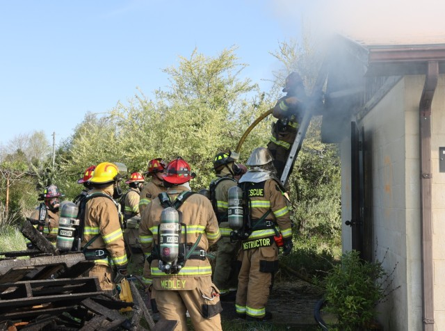 Firefighters from six different departments work to extinguish flames April 27, 2022 as part of a multi-department training exercise at Fort Knox.