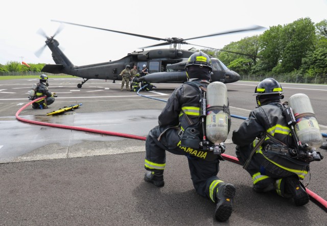 More than a dozen firefighters from the U.S. Army Garrison Japan Fire Department practiced an emergency response to a downed aircraft at Kastner Airfield, Camp Zama, Japan, April 28, 2022. A UH-60 Black Hawk helicopter, operated by two pilots and a crew chief from the U.S. Army Aviation Battalion Japan, simulated a crash landing that left its tail separated and severe injuries to the aircrew.